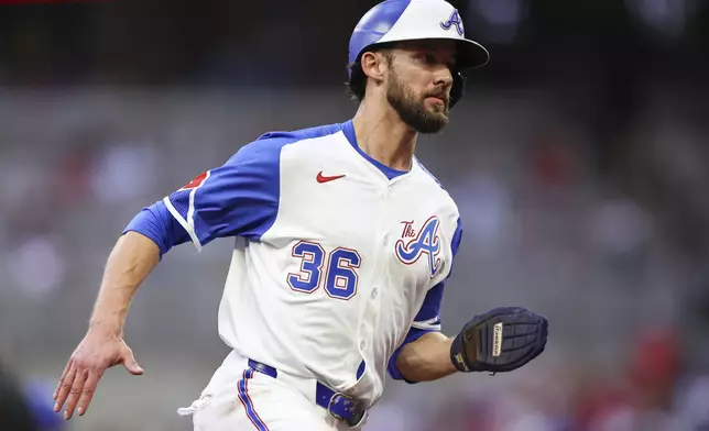 Atlanta Braves' Eli White (36) rounds third base before scoring a run in the second inning of a baseball game against the Philadelphia Phillies, Saturday, June 28, 2025, in Atlanta. (AP Photo/Colin Hubbard)