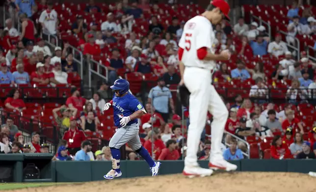 Toronto Blue Jays' Alejandro Kirk runs the bases after hitting a solo home run off St. Louis Cardinals pitcher Riley O'Brien during the eighth inning of a baseball game Monday, June 9, 2025, in St. Louis. (AP Photo/Scott Kane)