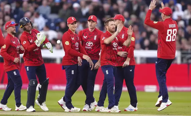 England's Liam Dawson, 3rd right, celebrates the wicket of West Indies' Johnson Charles, caught by Jos Buttler during the first men's international Twenty20 match between England and West Indies at Banks Homes Riverside, Chester-le-Street, England, Friday June 6, 2025. (Owen Humphreys/PA via AP)