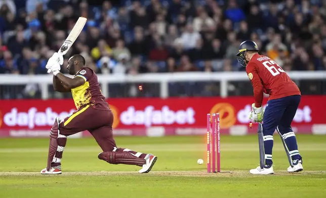 West Indies' Andre Russell is bowled out by England's Jacob Bethell during the first men's international Twenty20 match between England and West Indies at Banks Homes Riverside, Chester-le-Street, England, Friday June 6, 2025. (Owen Humphreys/PA via AP)