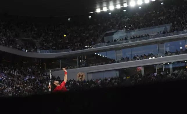 Serbia's Novak Djokovic serves against Germany's Alexander Zverev during their quarterfinal match of the French Tennis Open at the Roland-Garros stadium in Paris, Wednesday, June 4, 2025. (AP Photo/Lindsey Wasson)
