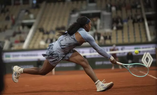 Coco Gauff of the U.S. plays a shot against Madison Keys of the U.S. during their quarterfinal match of the French Tennis Open at the Roland-Garros stadium in Paris, Wednesday, June 4, 2025. (AP Photo/Christophe Ena)