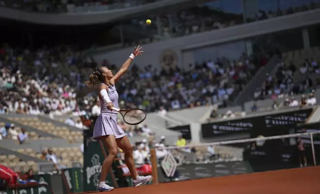 China's Qinwen Zheng serves against Aryna Sabalenka of Belarus during their quarterfinal match of the French Tennis Open at the Roland-Garros stadium in Paris, Tuesday, June 3, 2025. (AP Photo/Christophe Ena)
