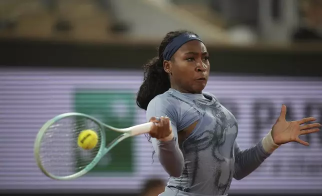 Coco Gauff of the U.S. plays a shot against Madison Keys of the U.S. during their quarterfinal match of the French Tennis Open at the Roland-Garros stadium in Paris, Wednesday, June 4, 2025. (AP Photo/Christophe Ena)