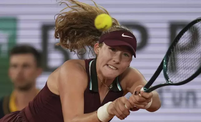 Russia's Mirra Andreeva plays a shot against France's Lois Boisson during their quarterfinal match of the French Tennis Open at the Roland-Garros stadium in Paris, Wednesday, June 4, 2025. (AP Photo/Christophe Ena)
