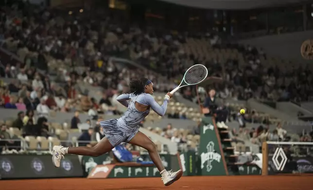 Coco Gauff of the U.S. plays a shot against Madison Keys of the U.S. during their quarterfinal match of the French Tennis Open at the Roland-Garros stadium in Paris, Wednesday, June 4, 2025. (AP Photo/Christophe Ena)