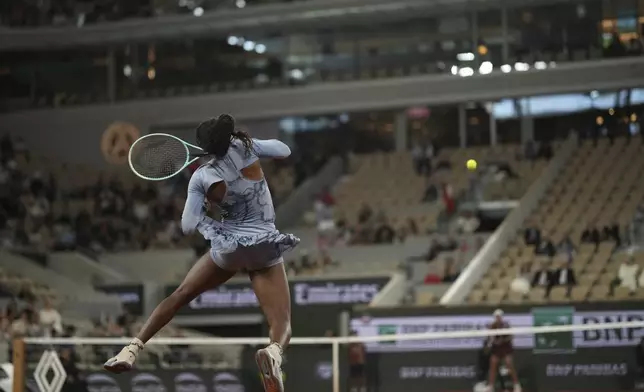 Coco Gauff of the U.S. plays a shot against Madison Keys of the U.S. during their quarterfinal match of the French Tennis Open at the Roland-Garros stadium in Paris, Wednesday, June 4, 2025. (AP Photo/Christophe Ena)