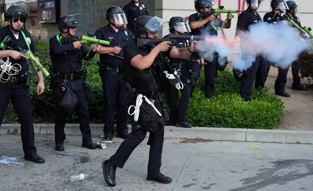 Los Angeles police department personnel fire non-lethal rounds at protesters on Monday, June 9, 2025, in downtown Los Angeles. (AP Photo Jae Hong)