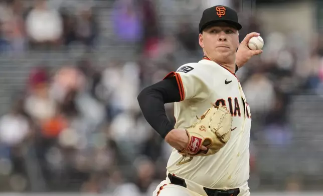 San Francisco Giants' Kyle Harrison pitches to a San Diego Padres batter during the first inning of a baseball game Wednesday, June 4, 2025, in San Francisco. (AP Photo/Godofredo A. Vásquez)