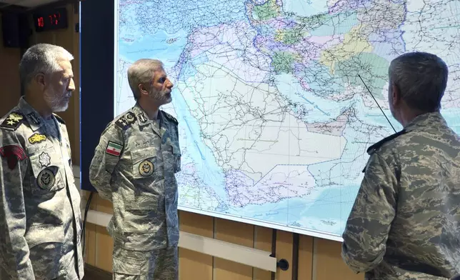 In this photo released on Monday, June 23, 2025, by Iranian army press service, Iran's army commander-in-chief Gen. Amir Hatami, center, Admiral Mahmoud Mousavi, right, and Admiral Habibollah Sayyari attend a meeting in Zolfaghar central headquarters, Iran. (Iranian Army Press Service via AP)