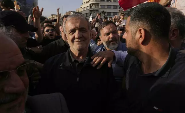 Iranian President Masoud Pezeshkian attends a protest following the U.S. attacks on nuclear sites in Iran, in Tehran, Iran, Sunday, June 22, 2025. (AP Photo/Vahid Salemi)