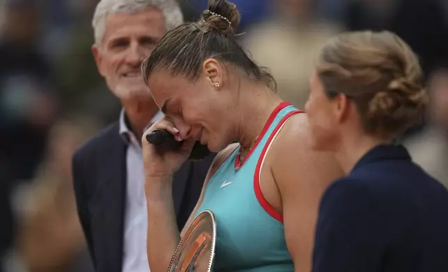 Aryna Sabalenka of Belarus cries during trophy presentation after losing the final match of the French Tennis Open at the Roland-Garros against United States' Coco Gauff in Paris, Saturday, June 7, 2025. (AP Photo/Thibault Camus)