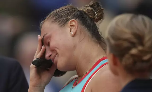 Aryna Sabalenka of Belarus cries during trophy presentation after losing the final match of the French Tennis Open at the Roland-Garros against United States' Coco Gauff in Paris, Saturday, June 7, 2025. (AP Photo/Thibault Camus)