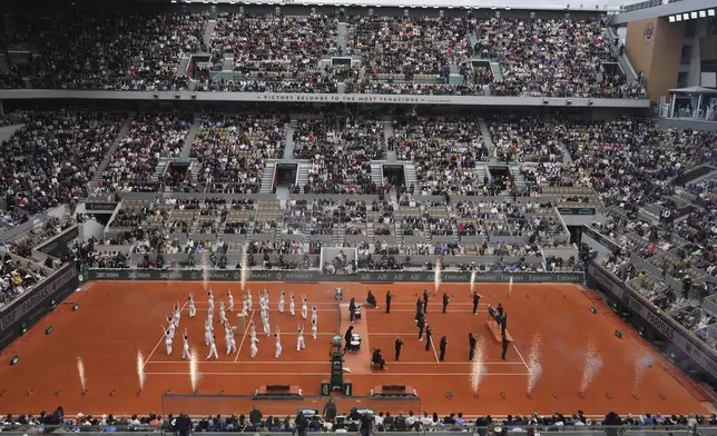Dane group performs before the final match of the French Tennis Open at the Roland-Garros in Paris, Saturday, June 7, 2025. (AP Photo/Lindsey Wasson)
