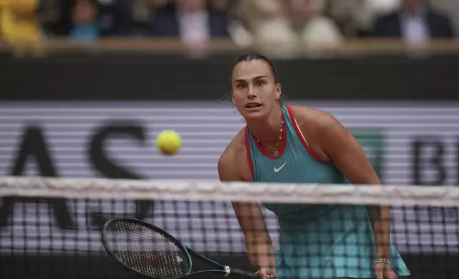 Aryna Sabalenka of Belarus plays a shot against Coco Gauff of the U.S. during their final match of the French Tennis Open at the Roland-Garros stadium in Paris, Saturday, June 7, 2025. (AP Photo/Christophe Ena)