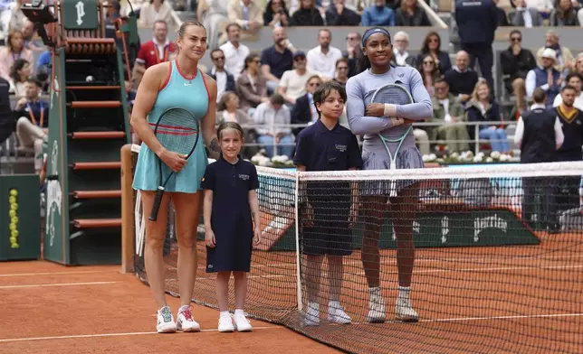 Aryna Sabalenka of Belarus, left, and Coco Gauff of the U.S. pose for a picture before their final match of the French Tennis Open at the Roland-Garros stadium in Paris, Saturday, June 7, 2025. (AP Photo/Aurelien Morissard)