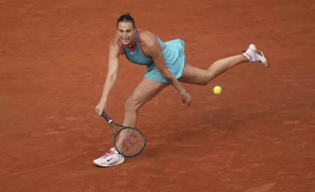 Aryna Sabalenka of Belarus plays a shot against Coco Gauff of the U.S. during their final match of the French Tennis Open at the Roland-Garros stadium in Paris, Saturday, June 7, 2025. (AP Photo/Christophe Ena)