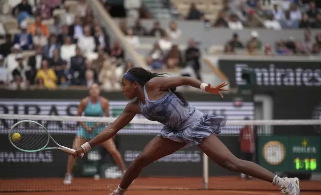 Coco Gauff of the U.S. plays a shot against Aryna Sabalenka of Belarus during their final match of the French Tennis Open at the Roland-Garros stadium in Paris, Saturday, June 7, 2025. (AP Photo/Christophe Ena)