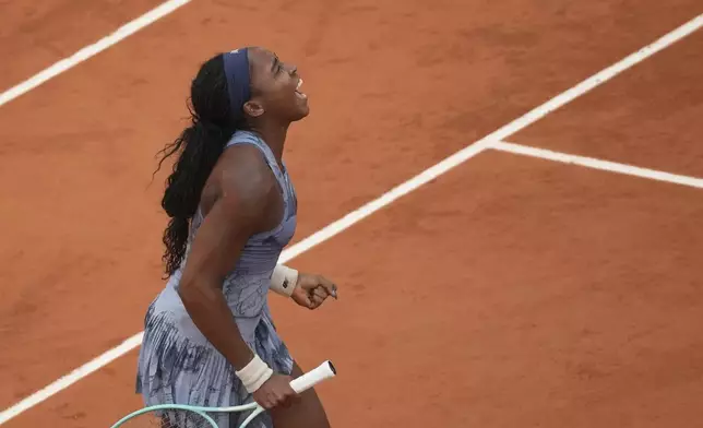 Coco Gauff of the U.S. celebrates as she won the final match of the French Tennis Open against Aryna Sabalenka of Belarus at the Roland-Garros stadium in Paris, Saturday, June 7, 2025. (AP Photo/Christophe Ena)