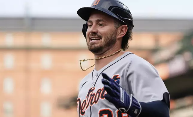 Detroit Tigers' Zach McKinstry (39) reacts after scoring on a sacrifice fly hit in by Wenceel Perez during the second inning of a baseball game against the Baltimore Orioles, Tuesday, June 10, 2025, in Baltimore. (AP Photo/Stephanie Scarbrough)
