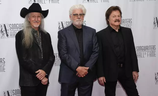 Patrick Simmons, Michael McDonald, Tom Johnston of the Doobie Brothers attend the 54th annual Songwriters Hall of Fame induction and awards gala on Thursday, June 12, 2025, at the Marriott Marquis Hotel in New York. (Photo by Charles Sykes/Invision/AP)