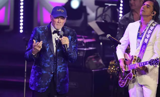 Mike Love, left, and John Stamos perform during the 54th annual Songwriters Hall of Fame induction and awards gala on Thursday, June 12, 2025, at the Marriott Marquis Hotel in New York. (Photo by Charles Sykes/Invision/AP)