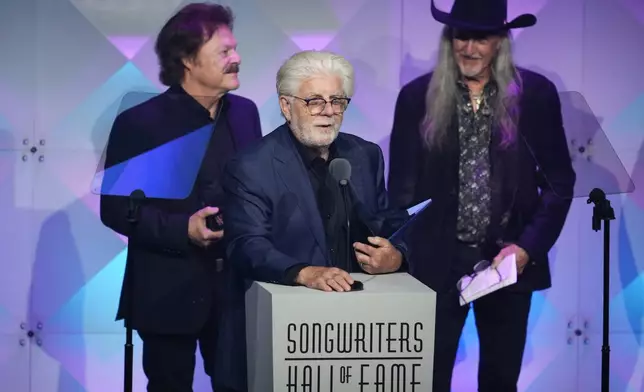Tom Johnston, from left, Michael McDonald, and Patrick Simmons of The Doobie Brothers accept an award during the 54th annual Songwriters Hall of Fame induction and awards gala on Thursday, June 12, 2025, at the Marriott Marquis Hotel in New York. (Photo by Charles Sykes/Invision/AP)