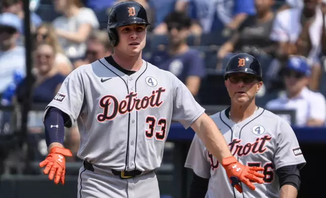 Detroit Tigers' Colt Keith (33) celebrates after hitting a single against the Kansas City Royals during the ninth inning of a baseball game in Kansas City, Mo., Sunday, June 1, 2025. (AP Photo/Reed Hoffmann)