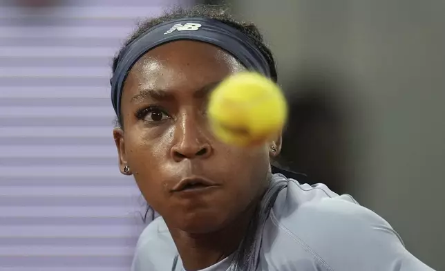 Coco Gauff of the U.S. plays a shot against Madison Keys of the U.S. during their quarterfinal match of the French Tennis Open at the Roland-Garros stadium in Paris, Wednesday, June 4, 2025. (AP Photo/Christophe Ena)