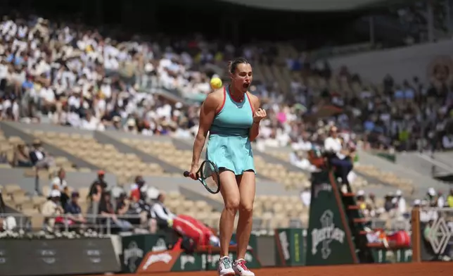 Aryna Sabalenka of Belarus reacts as she plays against China's Qinwen Zheng during their quarterfinal match of the French Tennis Open at the Roland-Garros stadium in Paris, Tuesday, June 3, 2025. (AP Photo/Christophe Ena)