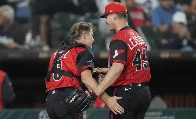 Chicago White Sox catcher Kyle Teel (8), left, celebrates with pitcher Jordan Leasure (49) after catching a pop out from Kansas City Royals' Salvador Perez (13) during the eighth inning of a baseball game Friday, June 6, 2025, in Chicago. (AP Photo/Erin Hooley)