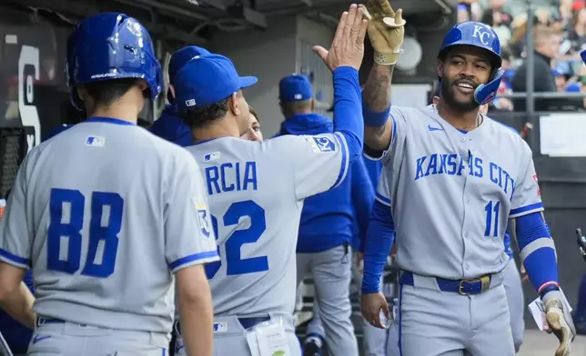 Kansas City Royals' Maikel Garcia (11) celebrates his home run during the third inning of a baseball game against the Chicago White Sox, Friday, June 6, 2025, in Chicago. (AP Photo/Erin Hooley)