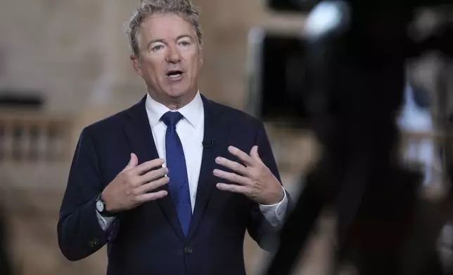 As Senate Republicans work to advance President Donald Trump's spending and tax bill, Sen. Rand Paul, R-Ky., who is opposed to the reconciliation package because of the debt-limit increase, does a TV news interview at the Capitol in Washington, Tuesday, June 3, 2025. (AP Photo/J. Scott Applewhite)