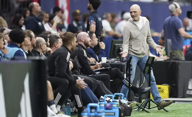 Vancouver Whitecaps head coach Jesper Sorensen, back right, stands on the sideline during the first half of an MLS soccer match against San Diego FC in Vancouver, British Columbia, Wednesday, June 25, 2025. (Darryl Dyck/The Canadian Press via AP)