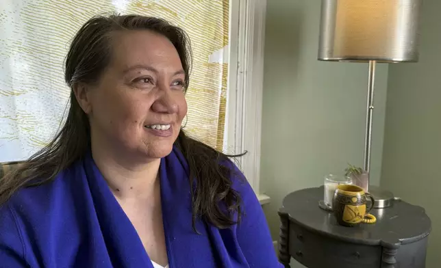 Siniva Bennett, board chair of the Samoa Pacific Development Corporation, sits in her home in Portland, Ore., Monday, May 19, 2025. (AP Photo/Claire Rush)