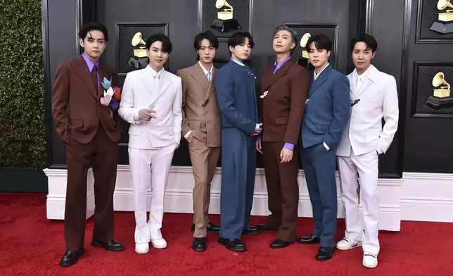 FILE - BTS arrives at the 64th Annual Grammy Awards at the MGM Grand Garden Arena on Sunday, April 3, 2022, in Las Vegas. (Photo by Jordan Strauss/Invision/AP, File)