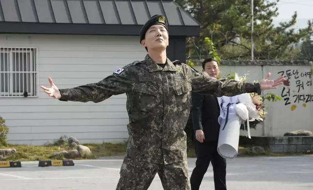FILE - K-pop band BTS's member J-Hope reacts after being discharged from a mandatory military service outside of an army base in Wonju, South Korea, Thursday, Oct. 17, 2024. (AP Photo/Ahn Young-joon, File)