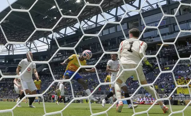 Mamelodi Sundowns' Iqraam Rayners (13) scores a goal during the Club World Cup Group F soccer match between Mamelodi Sundowns and Borussia Dortmund in Cincinnati, Saturday, June 21, 2025. (AP Photo/Carolyn Kaster)