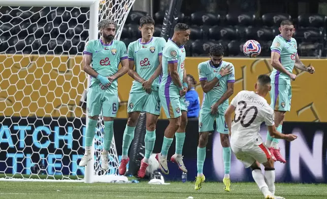 Manchester City's Claudio Echeverri (30) scores his side's second goal against Al Ain during the Club World Cup Group G soccer match between Manchester City and Al Ain in Atlanta, Sunday, June 22, 2025. (AP Photo/Brynn Anderson)