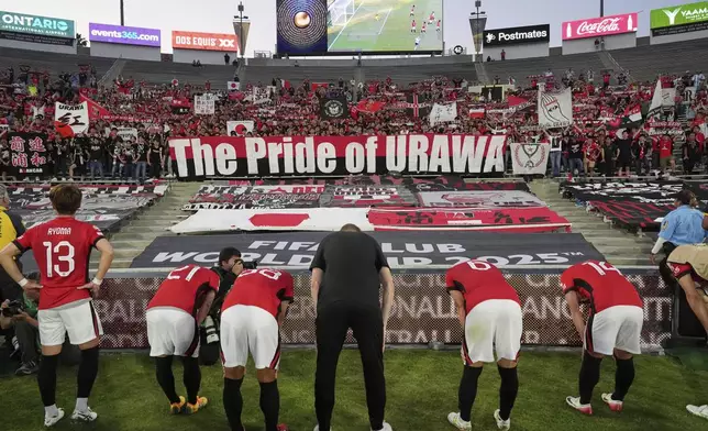 Urawa Red Diamonds players acknowledge fans following their loss in a Club World Cup Group E soccer match between Urawa Red Diamonds and CF Monterrey in Pasadena, Calif., Wednesday, June 25, 2025. (AP Photo/Gregory Bull)