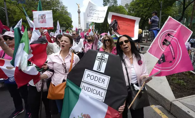 Demonstrators shouts slogans against the country's first judicial elections at a protest near the Angel of Independence in Mexico City, Sunday, June 1, 2025. (AP Photo/Fernando Llano)