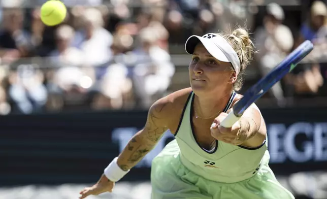 Czech Republic's Marketa Vondrousova returns the ball to Belarus' Aryna Sabalenka during their semifinal match of the Berlin tennis tournament in Berlin, Saturday, June 21, 2025. (Hannes Albert/dpa via AP)