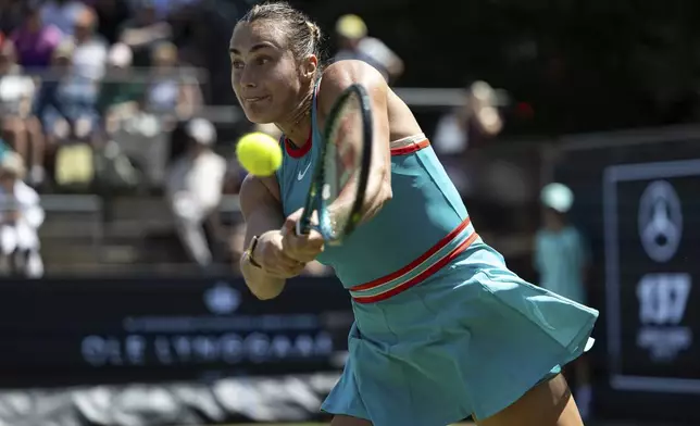 Belarus' Aryna Sabalenka returns the ball to Czech Republic's Marketa Vondrousova during their semifinal match of the Berlin tennis tournament in Berlin, Saturday, June 21, 2025. (Hannes Albert/dpa via AP)