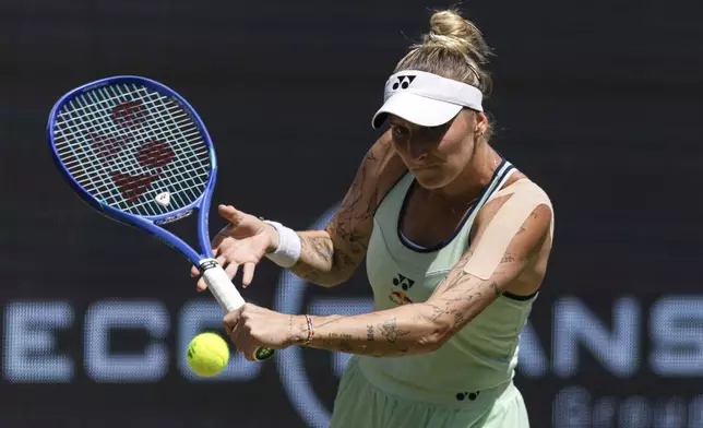 Czech Republic's Marketa Vondrousova returns the ball to Belarus' Aryna Sabalenka during their semifinal match of the Berlin tennis tournament in Berlin, Saturday, June 21, 2025. (Hannes Albert/dpa via AP)