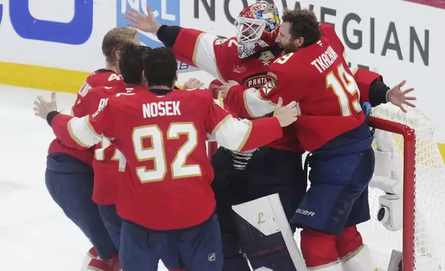 Florida Panthers goalie Sergei Bobrovsky (72) and teammates celebrate after defeating the Edmonton Oilers in Game 6 of the NHL hockey Stanley Cup Final in Sunrise, Fla., Tuesday, June 17, 2025. (Nathan Denette/The Canadian Press via AP)