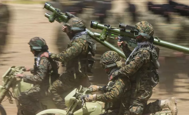 FILE - Fighters from the Lebanese militant group Hezbollah train in southern Lebanon, May 21, 2023. (AP Photo/Hassan Ammar, File)