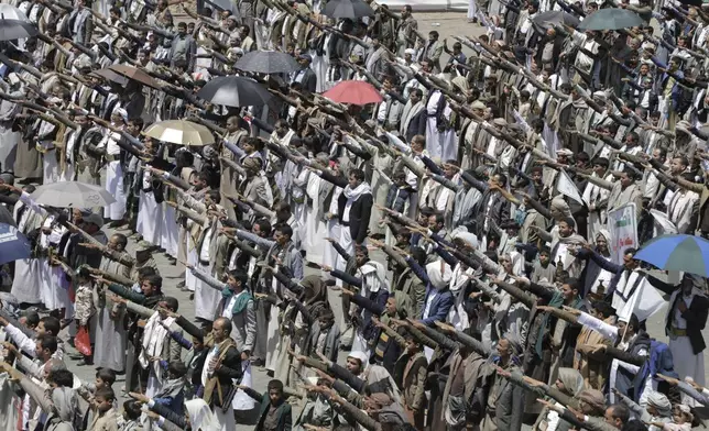 Yemeni Houthis chant religious slogans as they celebrate Eid al-Ghadir, the day on which they believe Islam was completed as a religion by the appointment of Ali as Prophet Muhammad's successor, at Al Imam Ali park in Sanaa, Yemen, Saturday, June 14, 2025. (AP Photo/Osamah Abdulrahman)