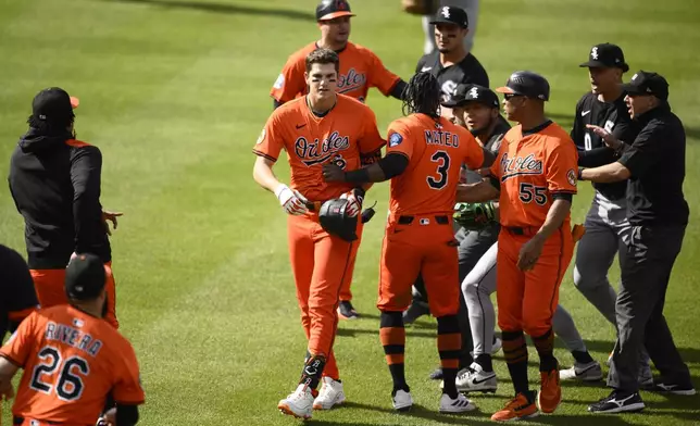 Baltimore Orioles Jorge Mateo (3) separates Coby Mayo, center left, and members of the Chicago White Sox during the fourth inning of a baseball game, Saturday, May 31, 2025, in Baltimore. (AP Photo/Nick Wass)