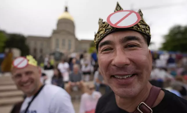 Frank Kong takes part in the "No Kings" protest, Saturday, June 14, 2025, in Atlanta. (AP Photo/Mike Stewart)