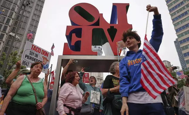Demonstrators chant and dance while participating in the "No Kings" protest, Saturday, June 14, 2025, in Philadelphia. (AP Photo/Yuki Iwamura)